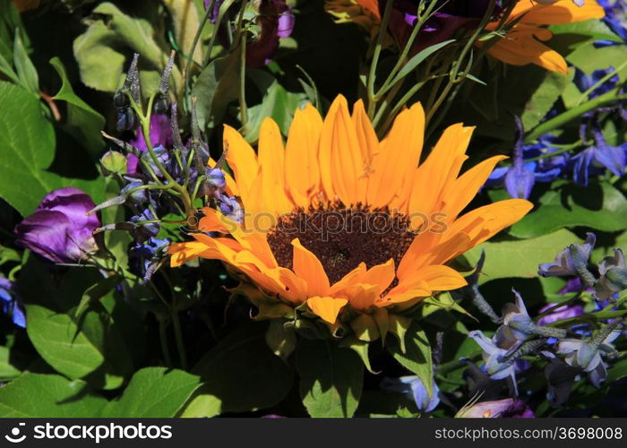 Mixed bouquet with big yellow sunflowers and purple eustoma