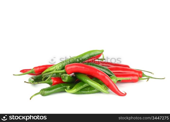 mixed chilli pile isolated on white