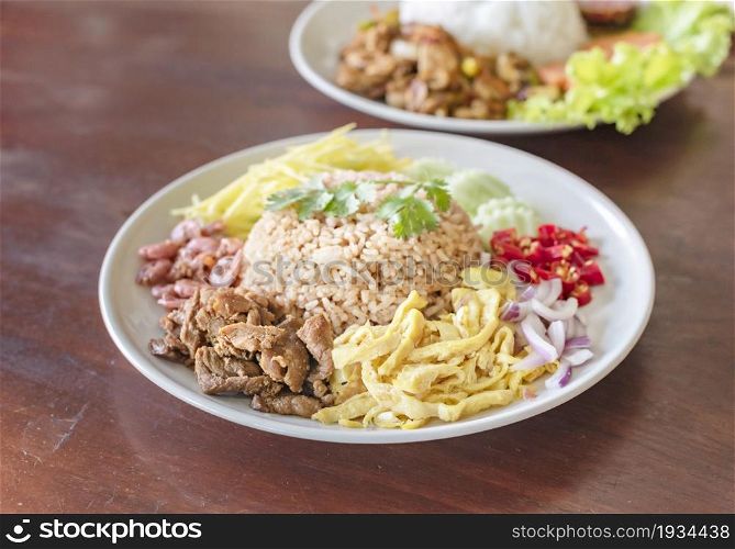 Mixed cooked rice with shrimp paste sauce , thai style food