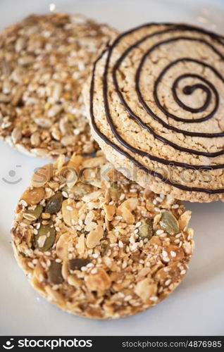 Mixed cookies closeup. Mixed cookies on a white plate