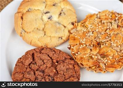 Mixed cookies on a white plate. Cookies