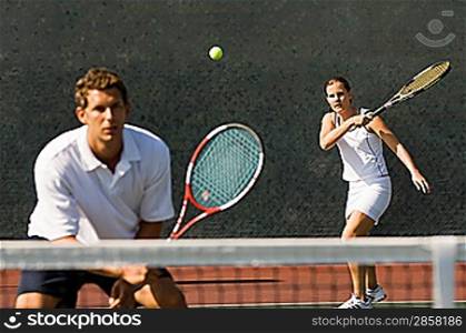 Mixed Doubles Partners in Tennis Match
