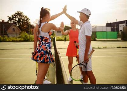 Mixed doubles tennis competition, outdoor court. Active healthy lifestyle, people play sport game with racket and ball, fitness workout with racquets. Mixed doubles tennis competition, outdoor court