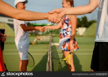 Mixed doubles tennis tournament, outdoor court. Active healthy lifestyle, people play sport game with racket and ball, fitness workout with racquets. Mixed doubles tennis tournament, outdoor court