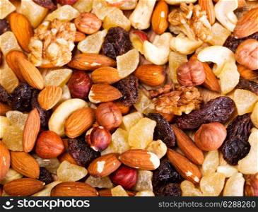 mixed dried nuts and fruit as background