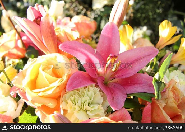 Mixed floral arrangement in various pastel colors, tigerlily in the center