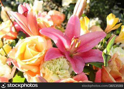 Mixed floral arrangement in various pastel colors, tigerlily in the center