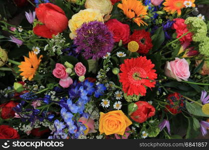 Mixed flower arrangement: various flowers in different colors for a wedding