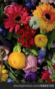 Mixed flower arrangement: various flowers in different colors for a wedding