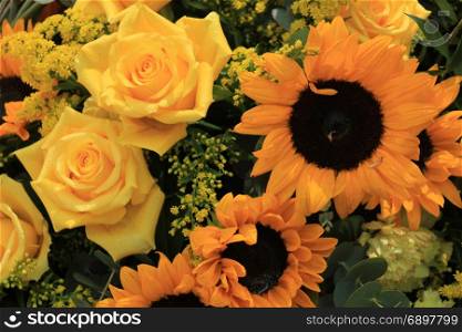 Mixed flower arrangement: various flowers in different shades of yellow for a wedding