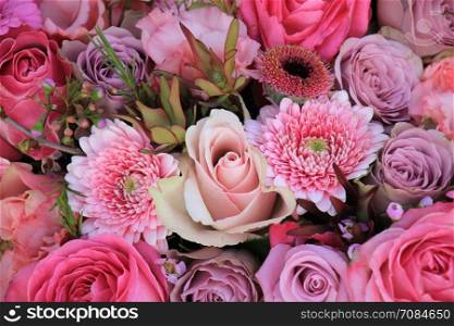 Mixed flowers in different shades of pink in a floral wedding decoration