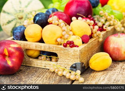 mixed fresh fruits in the wooden box