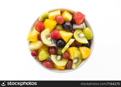 Mixed fruit with strawberry , kiwi , pineapple , dragon fruit , grape , and melon in white plate isolated on white background - Healthy food style
