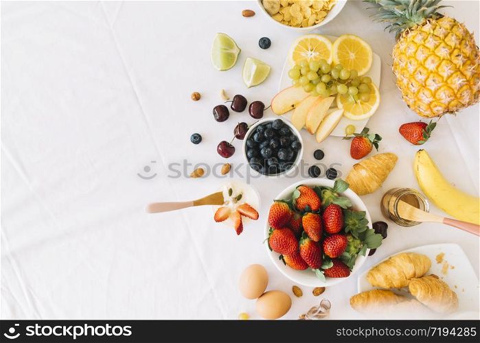 Mixed fruits with apple banana orange and other on wooden background - Healthy food style. Mixed fruits with apple banana orange and other