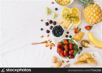 Mixed fruits with apple banana orange and other on wooden background - Healthy food style. Mixed fruits with apple banana orange and other