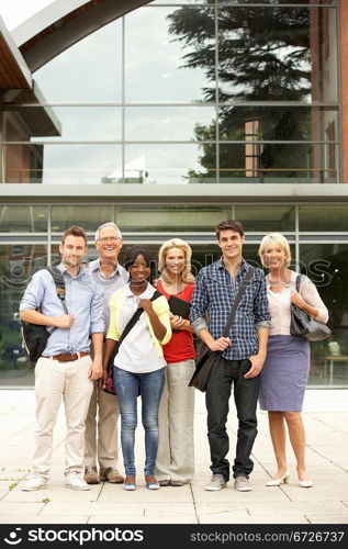 Mixed group of students outside college