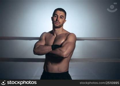 Mixed martial arts fighter posing in a ring. High quality photo. Mixed martial arts fighter posing in a ring. 