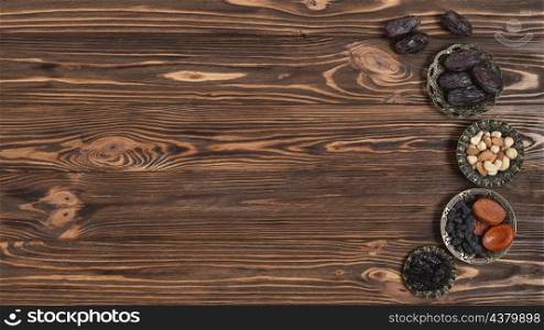 mixed nuts dates dried fruits ramadan festival wooden backdrop