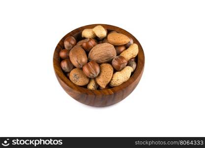 Mixed nuts in shells in a bowl a white background