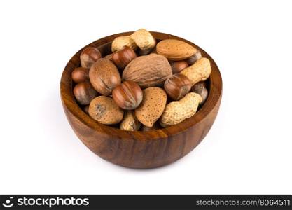 Mixed nuts in shells in a bowl a white background