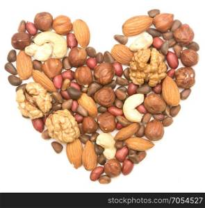 mixed nuts in the shape of the heart on white background
