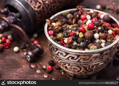 Mixed of peppercorn. set of peppers and a mill for grinding seasonings and spices