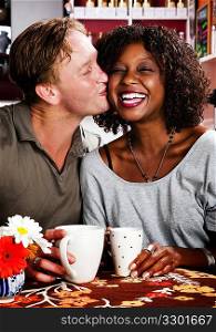 Mixed race couple in coffee house