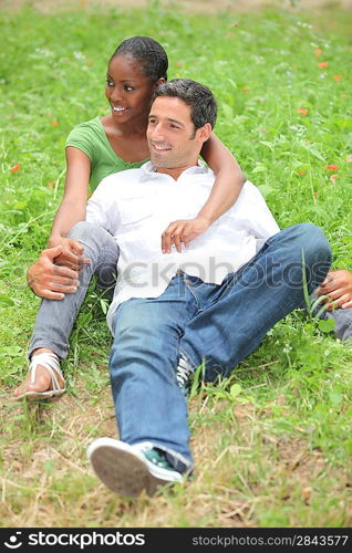 Mixed-race couple in park