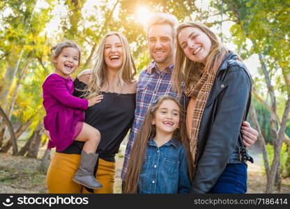 Mixed Race Family Members Having Fun Outdoors.