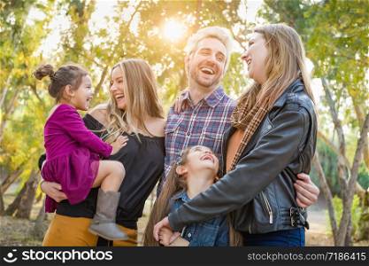 Mixed Race Family Members Having Fun Outdoors.
