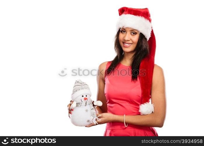 Mixed race woman in santa hat with little snowman.. Happy cute woman in santa claus hat holding little snowman. Attractive mixed race african girl isolated. Christmas season.