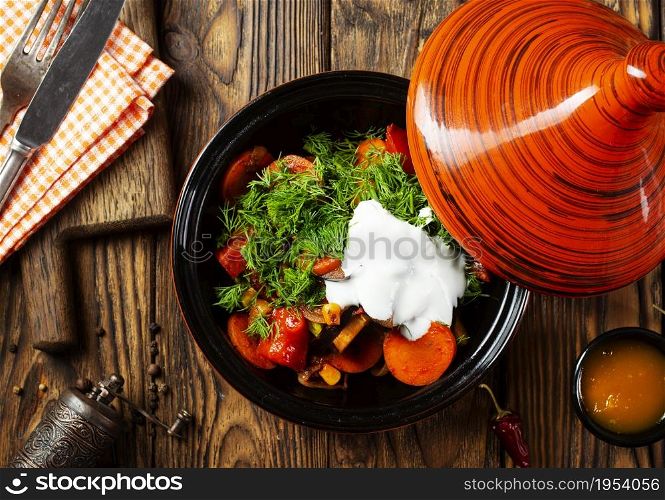 Mixed roasted vegetables with thyme in tagine.