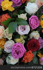 Mixed rose bouquet in many different colors like purple, pink, red, white, orange
