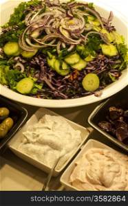 Mixed salad dish, olives, caviar roe spread