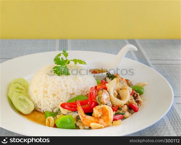 Mixed Seafood fried with chili and vegetables Served with steamed rice on dish. Mixed Seafood fried with chili