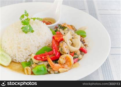 Mixed Seafood fried with chili and vegetables Served with steamed rice on dish. Mixed Seafood fried with chili