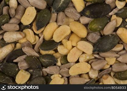 mixed seeds and nuts close up on dark background