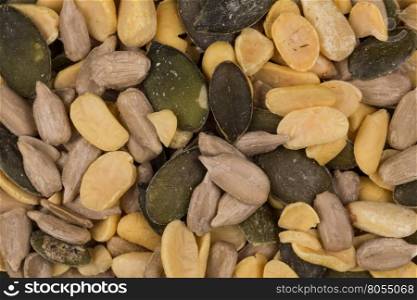 mixed seeds and nuts close up on dark background