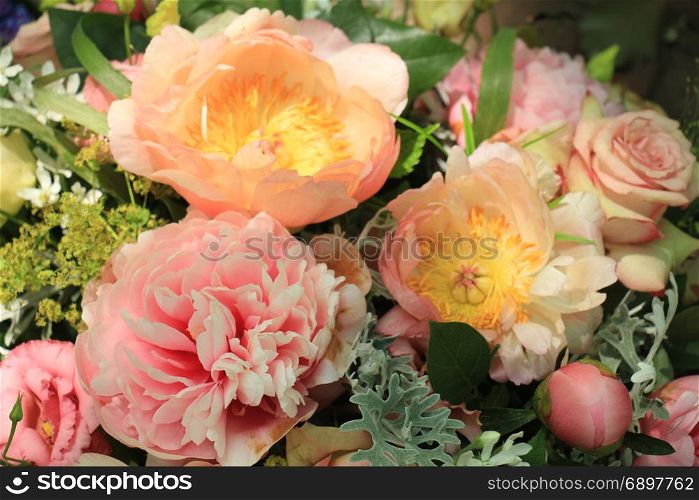 Mixed spring bouquet: roses and peonies in pale pink colors