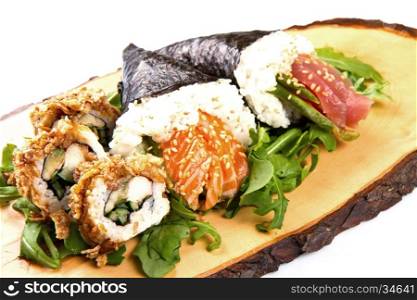 mixed sushi on wood dish