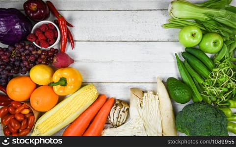 Mixed vegetables and fruits background healthy food clean eating for health / Assorted fresh ripe fruit red yellow purple and green vegetables market harvesting agricultural products