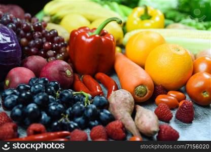 Mixed vegetables and fruits background healthy food clean eating for health / Assorted fresh ripe fruit red yellow and green vegetables market harvesting agricultural products