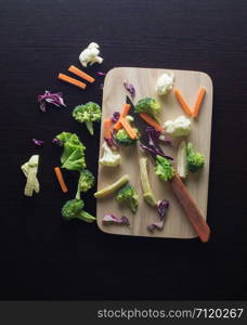 Mixed Vegetables have a carrots, broccoli, cauliflower, Purple cabbage, lettuce on cutting boards with knife - clean food concept