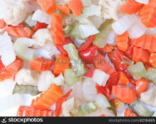 Mixed vegetables. Mixed vegetables as used in Russian Salad including carrots turnips courgettes zucchini cauliflower peppers celery onions olives