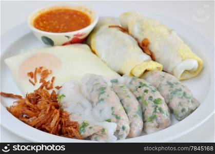 mixed vietnamese rice noodle rolls with a filling of pork sliced , egg and vegetable , fried onion