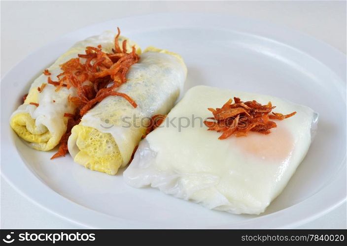 mixed vietnamese rice noodle rolls with a filling of pork sliced and egg , fried onion
