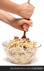 mixing a large bowl of chocolate chip cookie dough