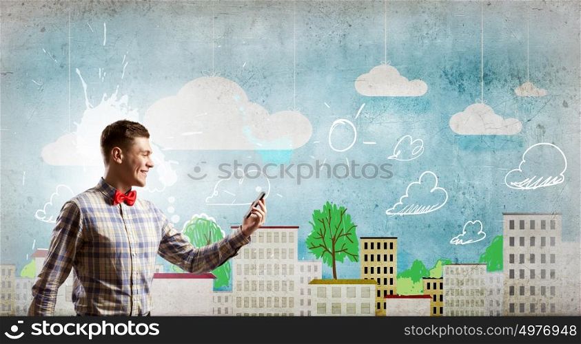 Mobile calls. Young man with mobile phone and colorful chat icons