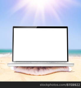 mobile office, modern laptop with blank screen on beach