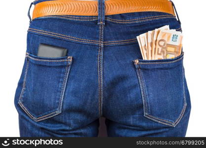 Mobile phone and euro notes in back pocket of blue jeans